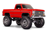 Red Traxxas TRX-4 Chevrolet K10 High Trail Edition remote control truck seen from a three-quarter front angle.