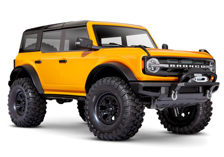 Traxxas TRX-4 2021 Ford Bronco 4x4 RTR crawler with orange body, detailed front and side view, off-road tires and rugged design.