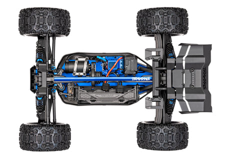 Traxxas 1/8 Sledge belted RC truck chassis viewed from above showing detailed structure and components.