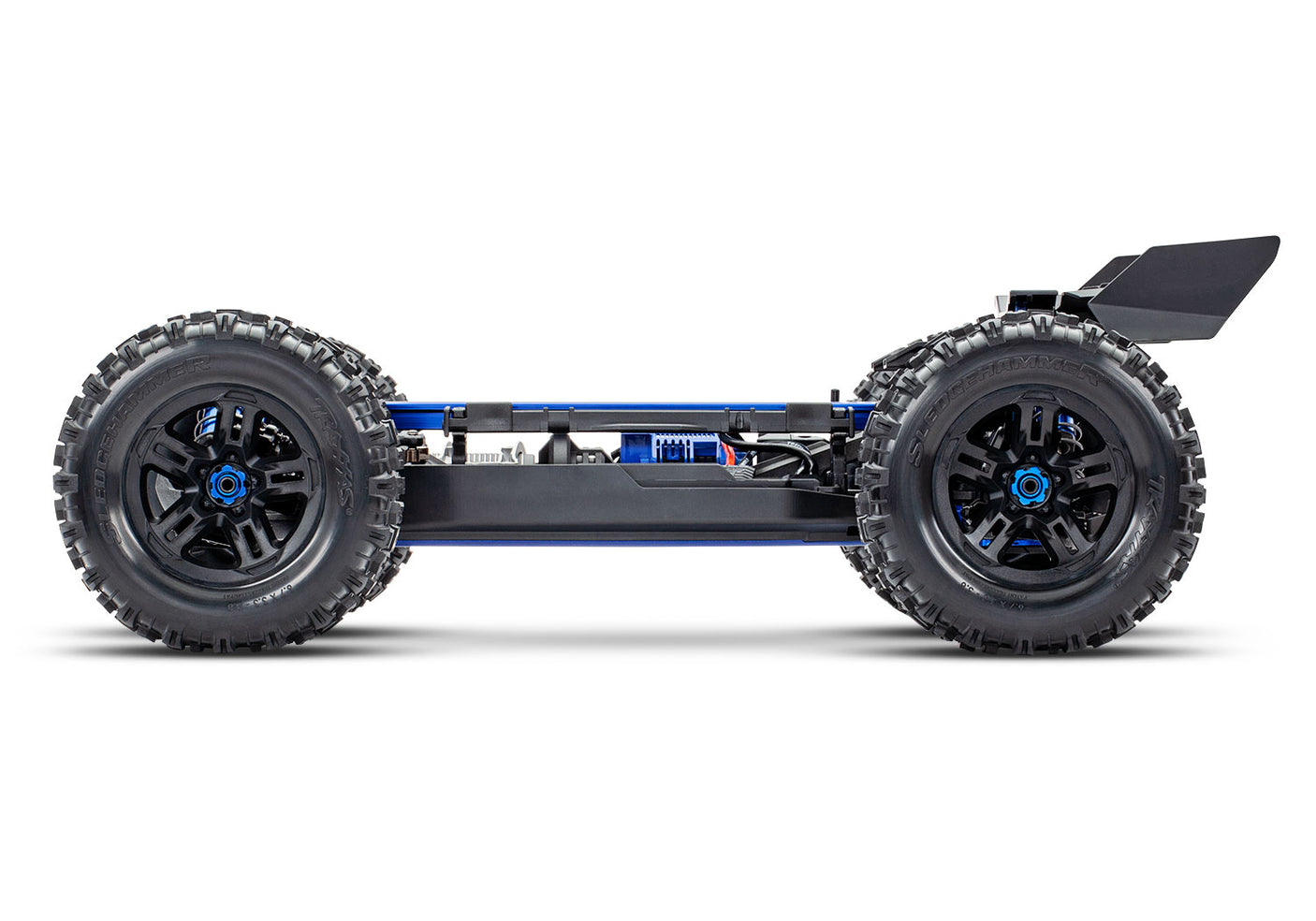 Side view of the Traxxas 1/8 Sledge belted RC truck chassis, showcasing the durable belt drive system and rugged construction.
