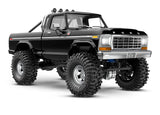 Traxxas TRX-4M 1/18 Ford F-150 High Trail Edition RC truck front three-quarter view in black with detailed exterior features.