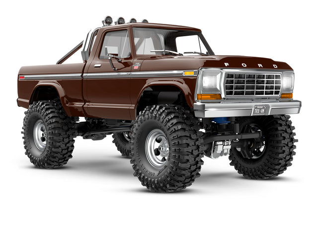 Traxxas TRX-4M Ford F-150 High Trail Edition remote control truck, 1/18 scale, brown front quarter view with detailed exterior.
