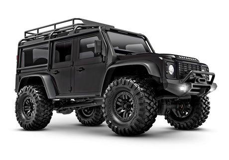Traxxas TRX-4M Land Rover Defender RC scale model vehicle, front three-quarter view with detailed black exterior.