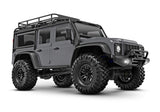 Traxxas TRX-4M Land Rover Defender radio-controlled scale model showing three-quarter front view with silver body.