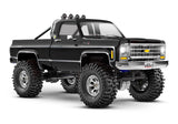 Traxxas TRX-4M Chevrolet K10 High Trail Edition RC truck, 1/18 scale, front three-quarter view in black.