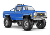 Traxxas TRX-4M 1/18 Chevrolet K10 High Trail Edition remote control truck, blue front three-quarter view.