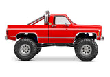 Red Traxxas TRX-4M 1/18 Chevrolet K10 High Trail Edition RC truck shown from the side.
