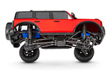 Traxxas TRX-4M Ford Bronco RC crawler with detailed body and realistic design, shown on a tilted surface.