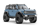 Traxxas TRX-4M Ford Bronco RC truck's front three-quarter view, showcasing detailed exterior and rugged design.