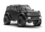 Traxxas TRX-4M Ford Bronco remote control toy vehicle, front three-quarter view with black body and detailed exterior.