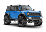 Blue Traxxas TRX-4M Ford Bronco remote control vehicle shown from a 3/4 front angle, showcasing detailed exterior and rugged design.