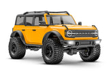 Traxxas TRX-4M Ford Bronco remote control off-road RC vehicle, orange with detailed front and side view.