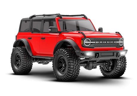Red Traxxas TRX-4M Ford Bronco radio-controlled vehicle shown from a three-quarter front angle.