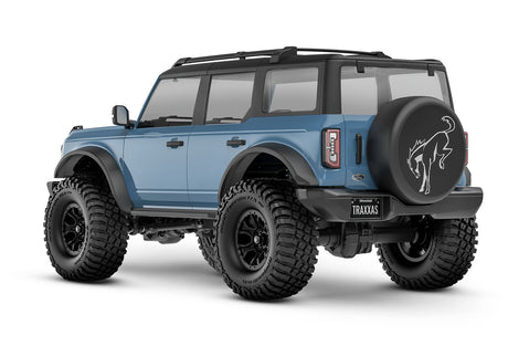Rear view of the Traxxas TRX-4M Ford Bronco RC truck showing detailed body and off-road tires from a three-quarter angle.