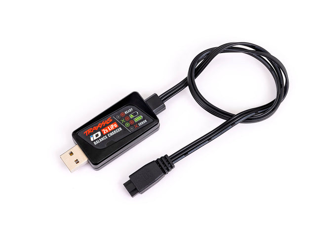Traxxas 2-Amp USB LiPo Charger connected to a battery, showing compact design and charging port for RC batteries.