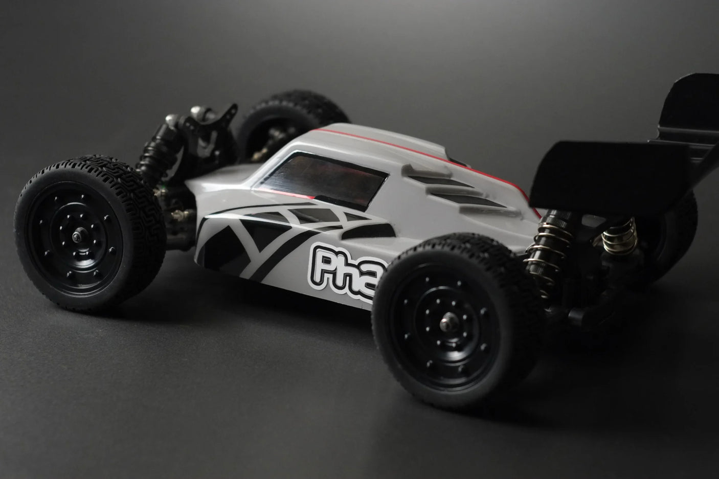 RC buggy body by Phat Bodies for 190mm wheelbase, featuring a sleek design and detailed graphics for model car racing.