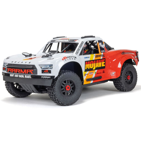 ARRMA 1/8 Mojave 4S 4X4 RTR desert truck shown with rugged off-road tires and detailed desert vehicle design.