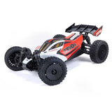 ARRMA 1/14 Typhon GROM 4X4 RTR brushed buggy on rugged terrain, showcasing its off-road design and vibrant orange body.