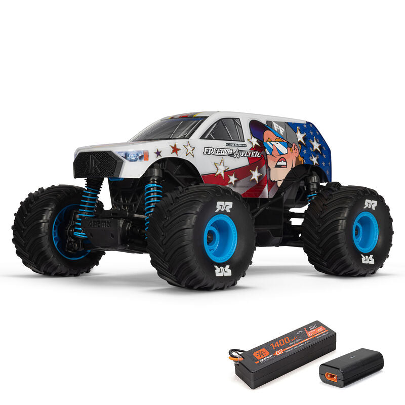 Red and black ARRMA 1/16 scale Freedom Flyer 4x4 monster truck with rugged tires and detailed body design.
