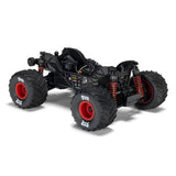 ARRMA 1/16 Quake Grom 4x4 RTR brushed monster truck on rugged terrain, showcasing its compact size and aggressive design.