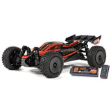 Arrma 1/14 Typhon GROM 223S DSC 4x4 RTR brushless buggy with detailed body and off-road tires on rugged terrain