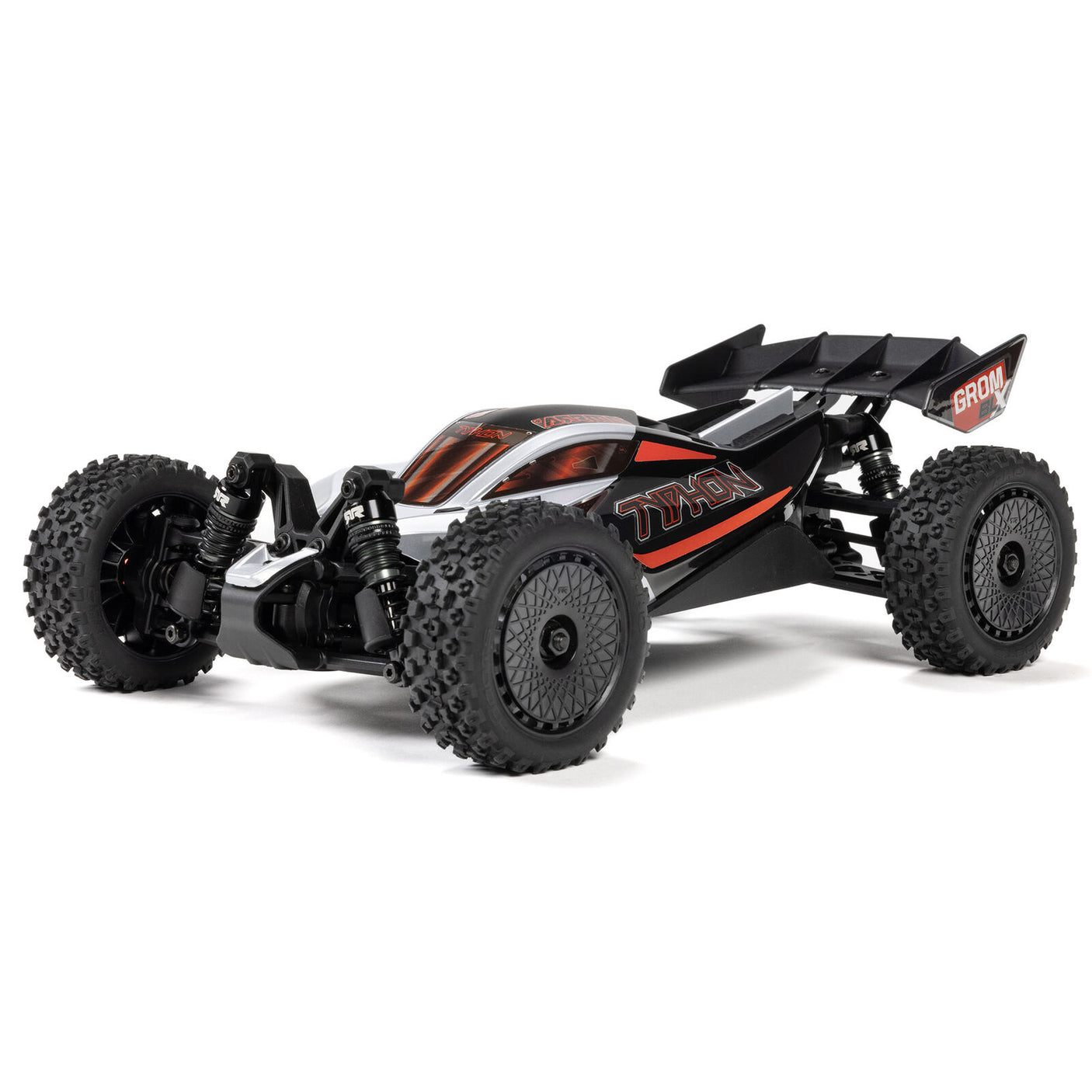 Silver ARRMA 1/14 Typhon GROM 223S DSC 4X4 RTR brushless buggy on a track, showcasing its detailed design and rugged build.