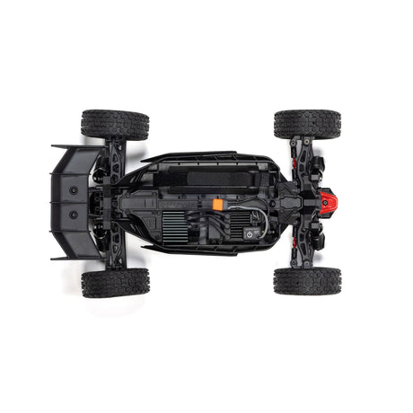 Silver ARRMA 1/14 Typhon GROM 223S DSC 4X4 RTR brushless buggy on a track with detailed components visible