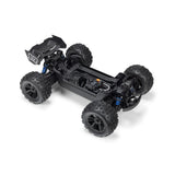 ARRMA 1/16 Mini Kraton 3S RC truck with charger and battery, showcasing the detailed miniature off-road vehicle on a display surface.
