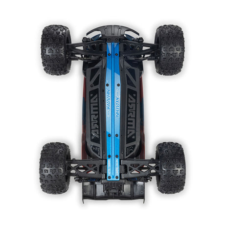 ARRMA 1/16 Mini Kraton 3S RC car with charger and battery, shown in action on rough terrain.