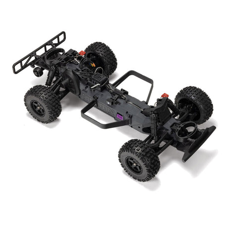 ARRMA 1/10 scale Fury 223S DSC 2WD RTR brushless short course truck on a track, showcasing its rugged design and vibrant color scheme.