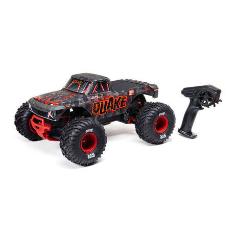 ARRMA 1/10 Quake 223S DSC 2WD RTR brushless monster truck on rugged terrain with bright green body and large off-road tires.