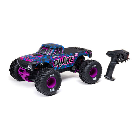 ARRMA 1/10 Quake 223S DSC 2WD RTR Brushless Monster Truck shown on rugged terrain with bright orange body and large off-road tires.