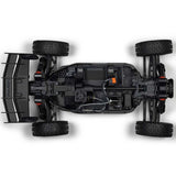 ARRMA 1/8 scale Typhon 4x4 RTR brushed buggy on rugged terrain with detailed body and large off-road tires.