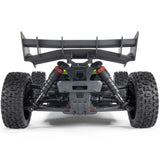 ARRMA 1/8 scale TYPHON 4x4 RTR brushed buggy on rugged terrain, showcasing its off-road design and vibrant orange color.