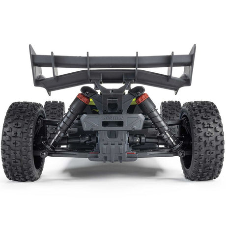 ARRMA 1/8 scale TYPHON 4x4 RTR brushed buggy on rugged terrain, showcasing its off-road design and vibrant orange color.
