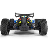 ARRMA 1/8 Typhon 4x4 RTR brushed buggy on rugged terrain with detailed body and large tires, ready for off-road racing.