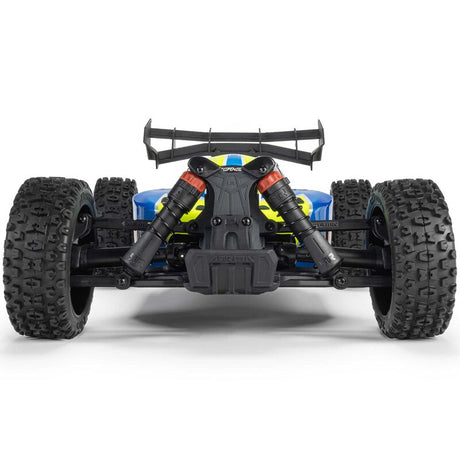 ARRMA 1/8 Typhon 4x4 RTR brushed buggy on rugged terrain with detailed body and large tires, ready for off-road racing.
