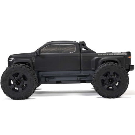 ARRMA 1/10 scale Big Rock 223S DSC 4x4 RTR brushless monster truck on rugged terrain, showcasing its powerful off-road design