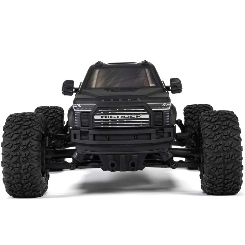 ARRMA 1/10 Big Rock 223S DSC 4x4 RTR brushless monster truck on rugged terrain, showcasing its off-road design and powerful build.