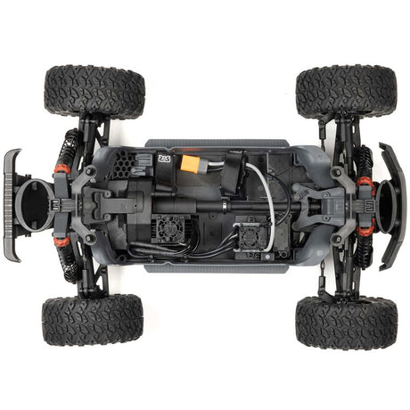 ARRMA 1/10 scale Big Rock 223S DSC 4x4 RTR brushless monster truck on rugged terrain, showcasing its durable design and powerful build.