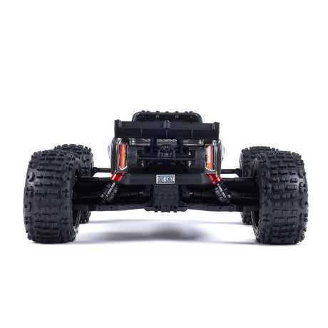 ARRMA Outcast 4X4 4S 1/10th scale 4WD stunt truck with rugged design and bright orange color, ready for off-road action.