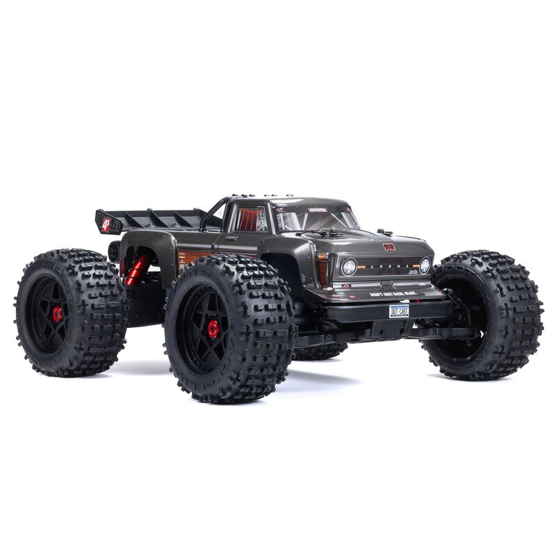ARRMA Outcast 4X4 4S 1/10th scale 4WD stunt truck with rugged tires and aggressive design, ready for off-road action.