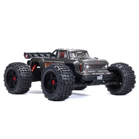 ARRMA Outcast 4X4 4S 1/10th scale 4WD stunt truck with rugged tires and aggressive design, ready for off-road action.