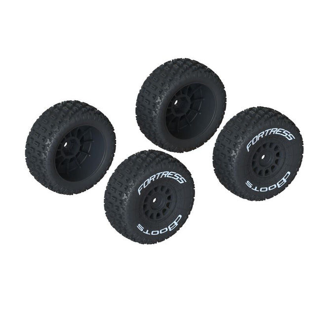 Set of four ARRMA dBoots Fortress mounted tires for Mojave GROM RC truck, showing rugged tread and durable rubber construction.