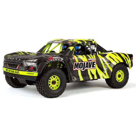 ARRMA Mojave 6S 4x4 RTR brushless short course truck in blue with large off-road tires and detailed body design.