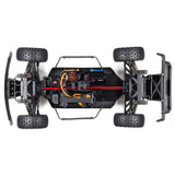 ARRMA Mojave 6S 4x4 RTR brushless short course truck, showing its rugged off-road design and bright orange body with large tires.