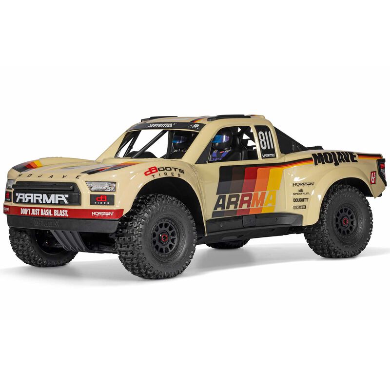 ARRMA Mojave 6S 4x4 RTR brushless desert truck shown with rugged tires and off-road suspension in a desert setting