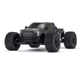 ARRMA 1/7 Big Rock 6S 4WD BLX RTR monster truck shown on rugged terrain with large tires and powerful suspension.