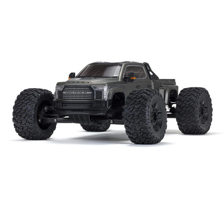 ARRMA 1/7 Big Rock 6S 4WD BLX RTR monster truck shown on rugged terrain with large tires and powerful suspension.