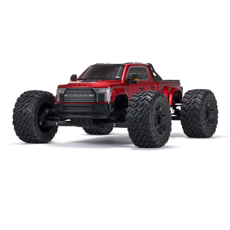 ARRMA 1/7 Big Rock 6S 4WD BLX RTR monster truck with large tires, rugged chassis, and vibrant orange and black body design.